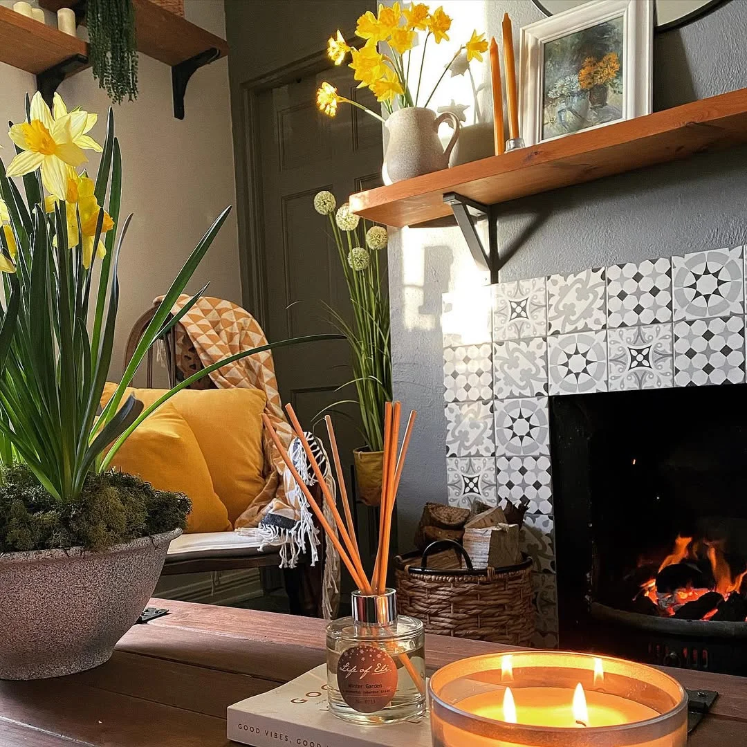 Cozy Fireplace with Spring Flowers and Candles