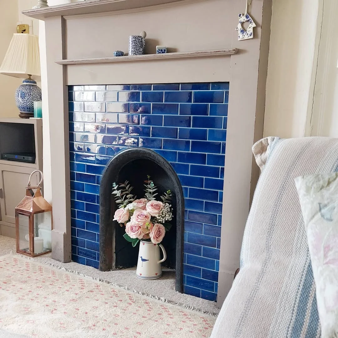 Blue Tiled Fireplace with Pink Roses