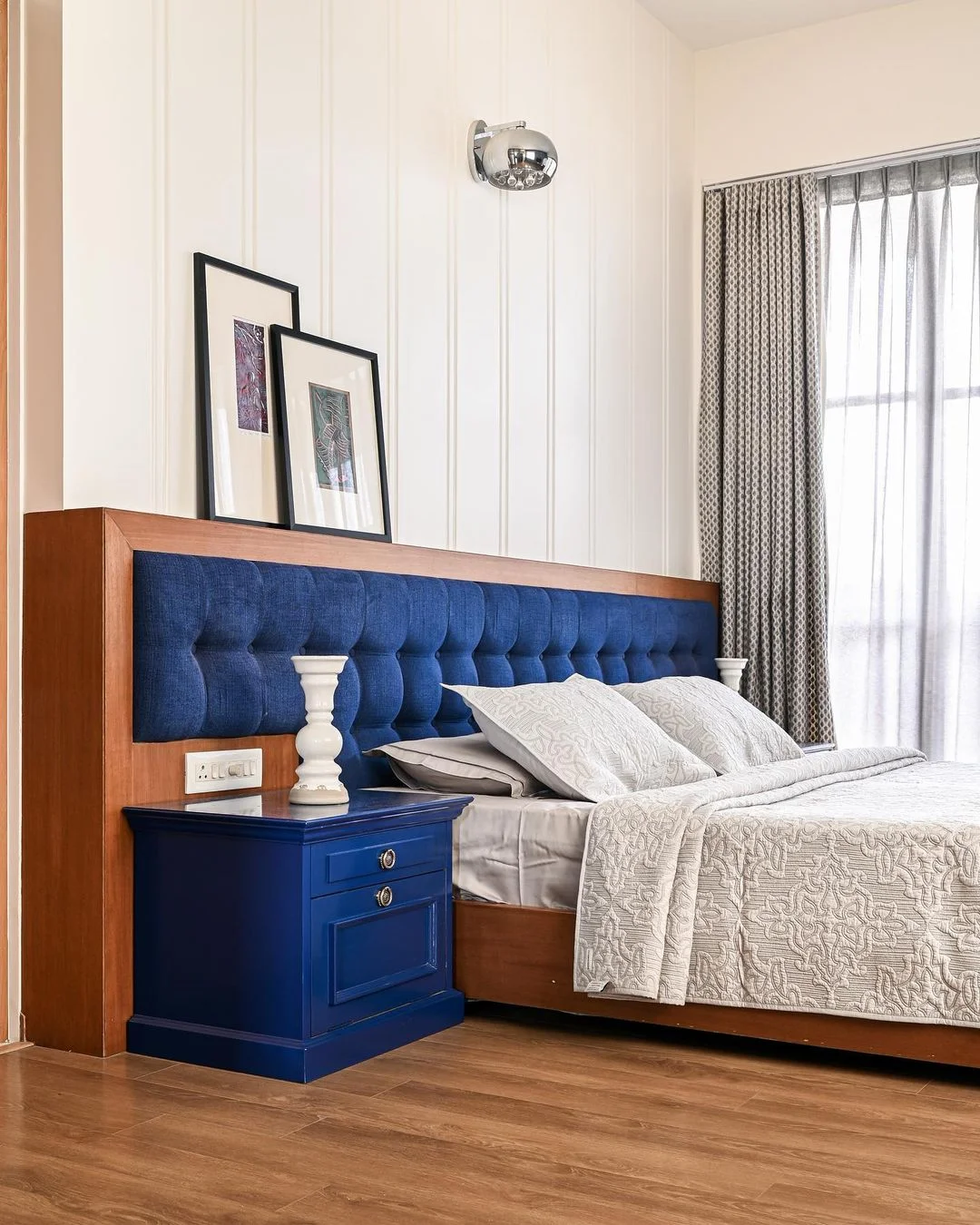 Modern Bedroom with Blue Tufted Headboard