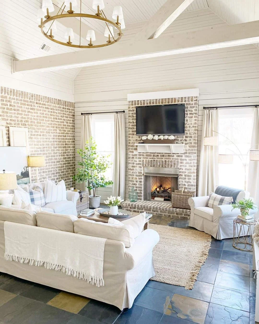 Vaulted Plank Ceiling Living Room with Brick Fireplace