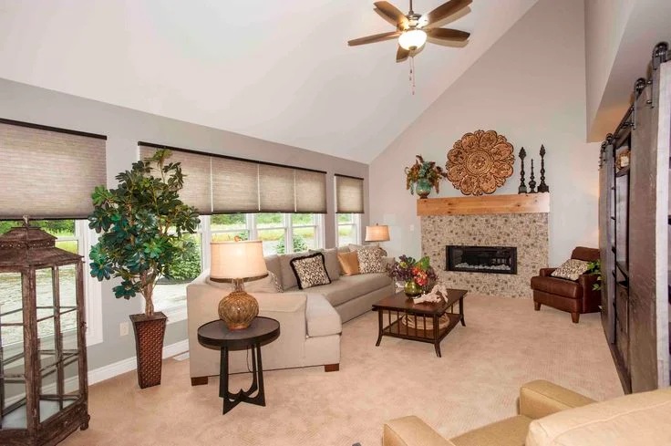 Half Vaulted Ceiling Living Room with Pebble Fireplace