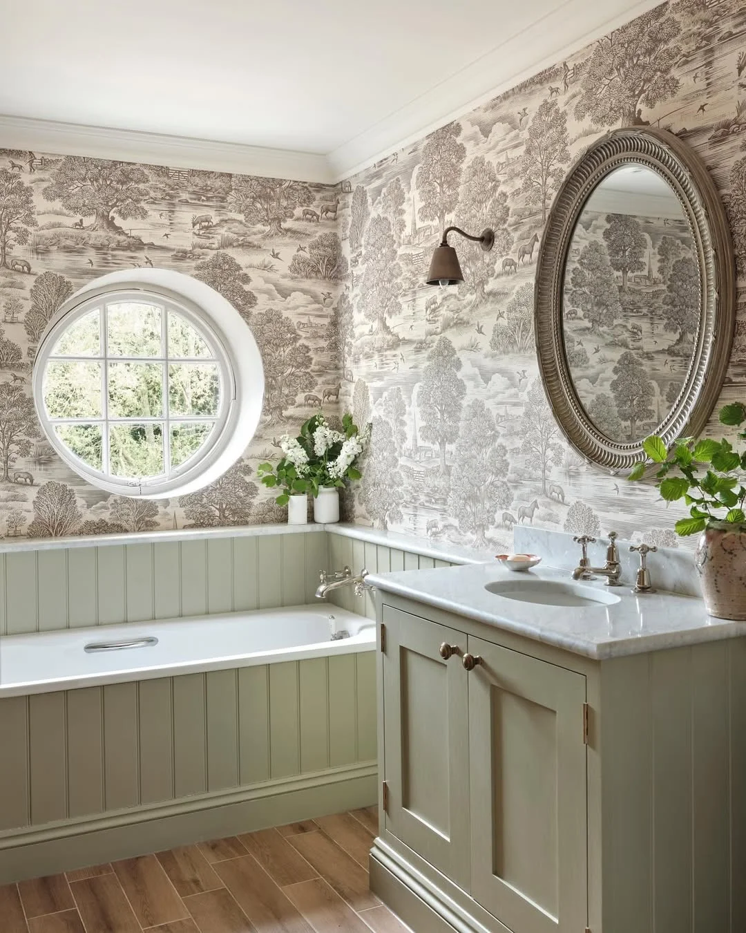 Serene Bathroom with Toile Wallpaper and Wainscoting