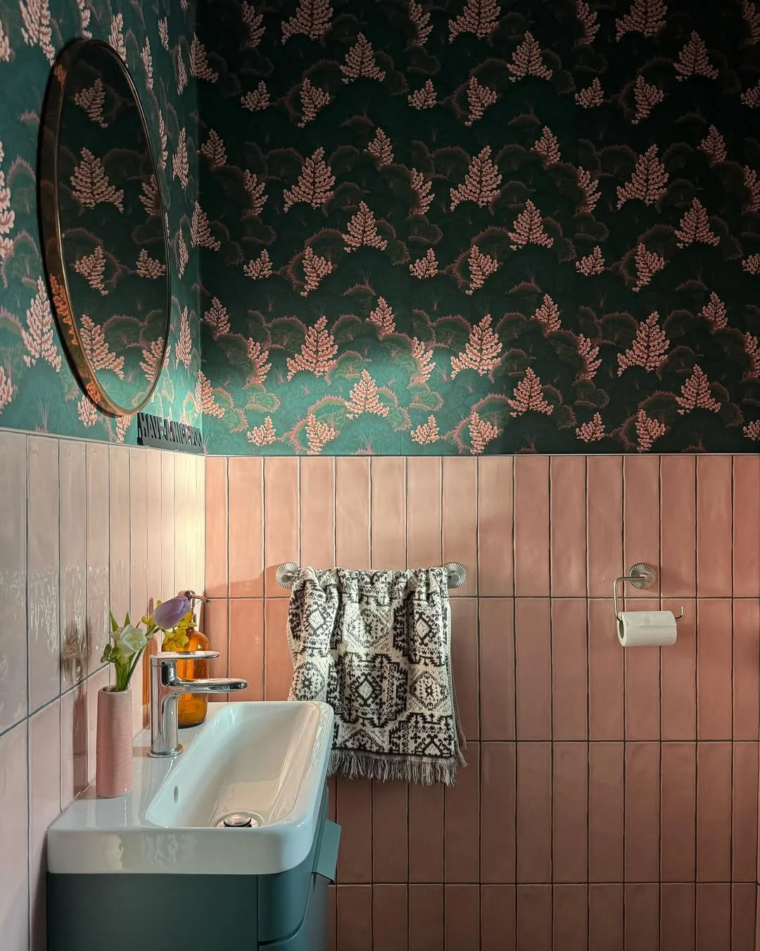 Moody Bathroom with Dark Green Wallpaper and Pink Tile