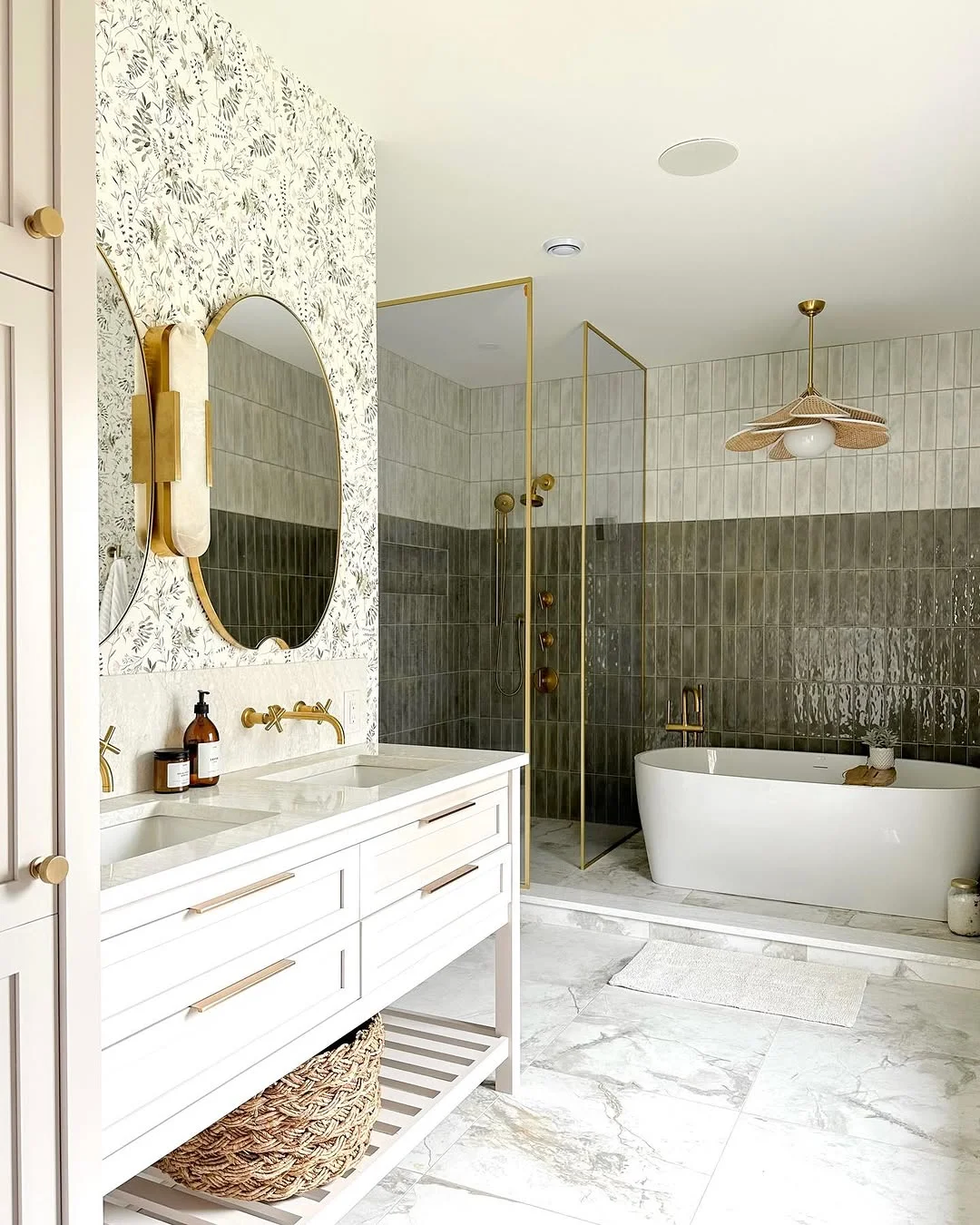 Bright and Airy Bathroom with Gold Accents and Botanical Wallpaper