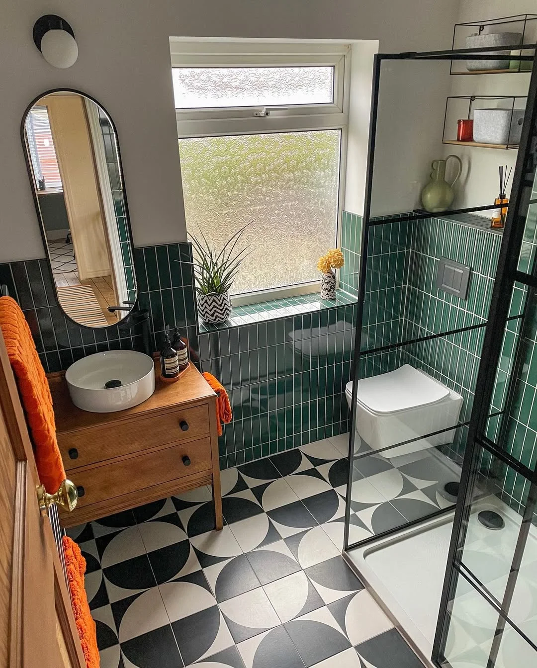 Retro-Modern Bathroom with Emerald Green Tile and Bold Floor