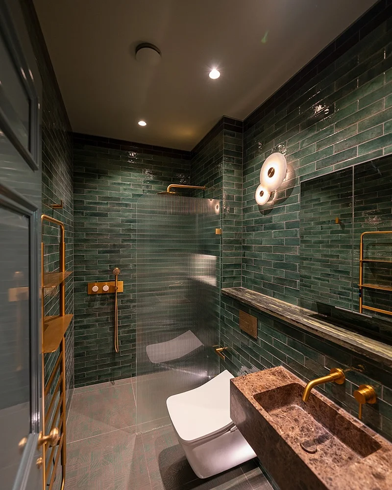 Moody Emerald Green Bathroom with Reeded Glass Shower