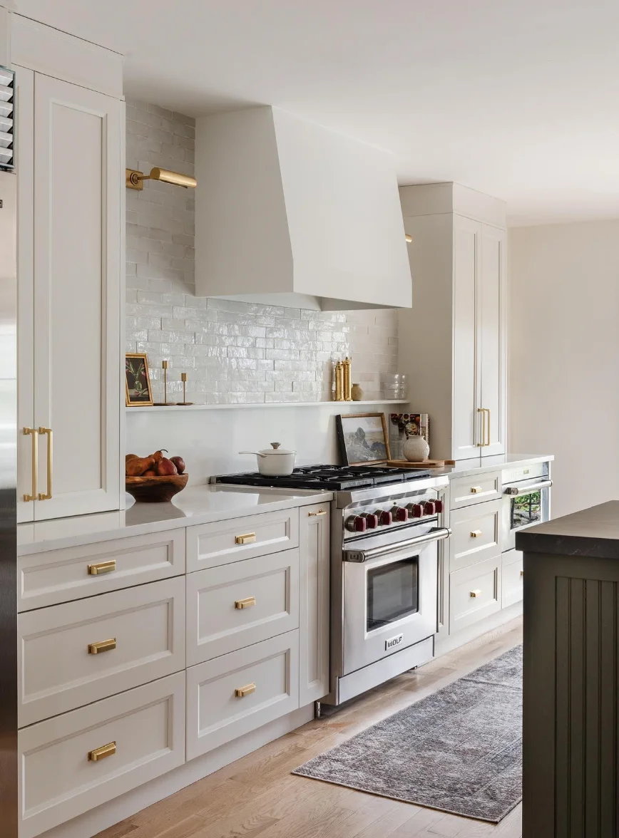 Gold and White Kitchen with Cozy Wood Floors