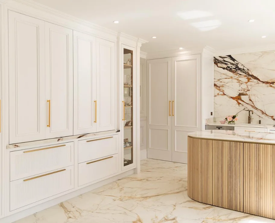 Timeless Elegance: Shaker Cabinets with Yellow Gold Touches